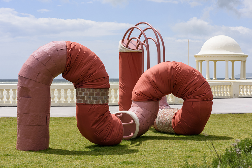 A giant composite worm of different materials including wobbly metal ducting