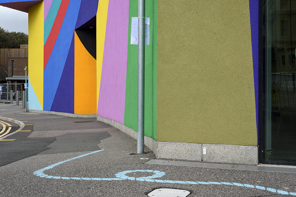 A chalk stencilled rope demarcating a jagged, unexpected route through the town